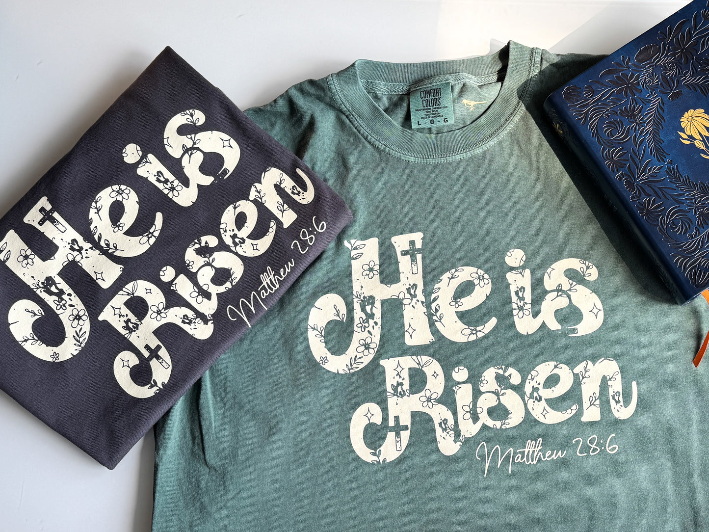 He is Risen Easter Comfort Colors Tee, Beige on Graphite/Blue Spruce