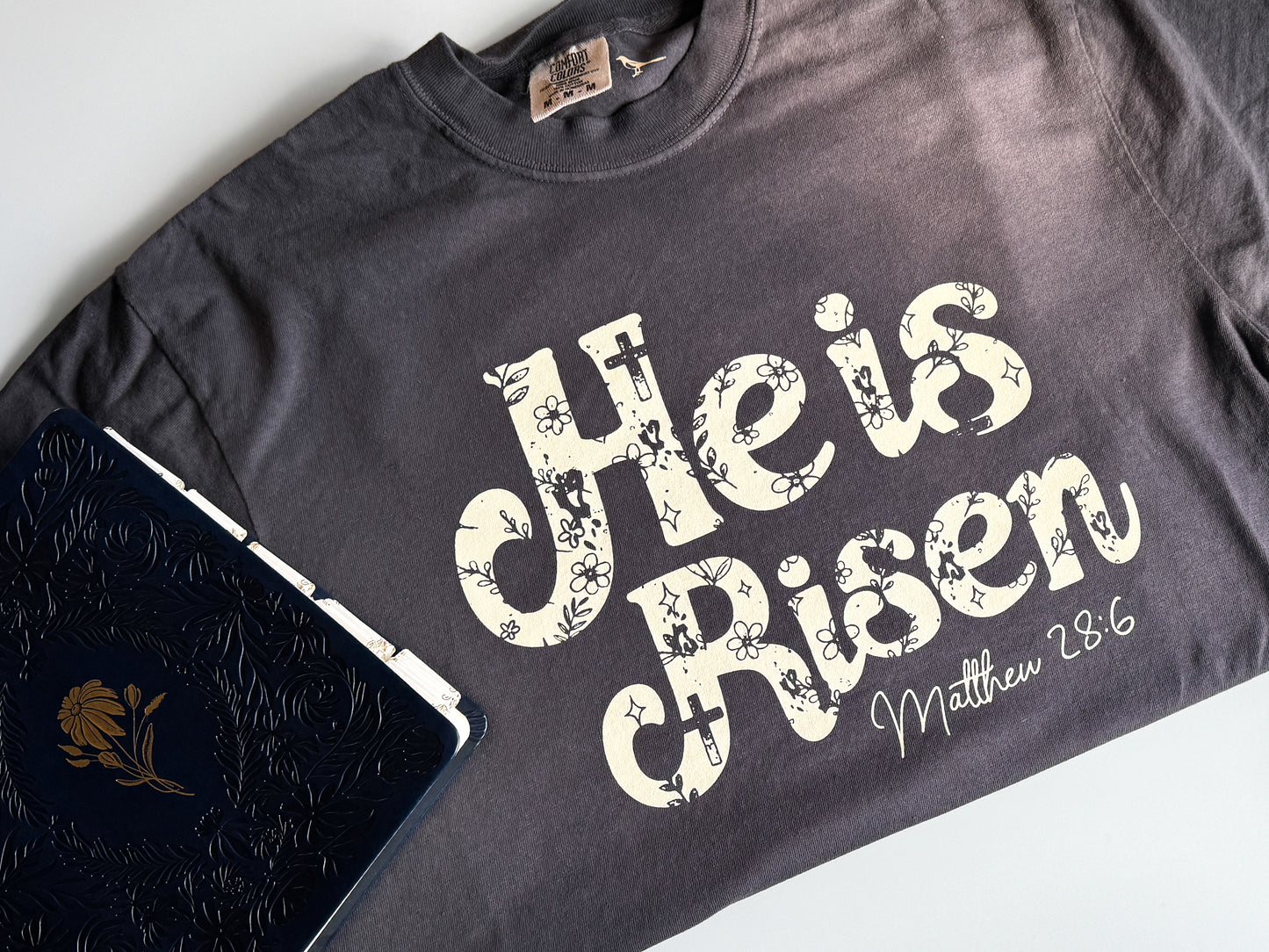 He is Risen Easter Comfort Colors Tee, Beige on Graphite/Blue Spruce